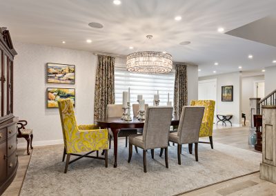 Enjoy a fabulous dinner in this colourful dining room. Lots of custom furniture and amazing art. Whole house renovation - Calgary Interior Designer
