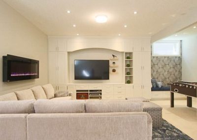Entertain to your heart's content in this cozy basement. Calgary Interior designer and decorator
